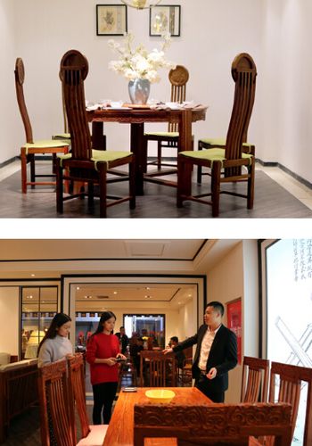 乐梨现代新中式家具销售总经理何铁长先生(右一)为记者介绍产品